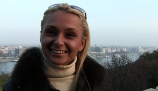 Ivana Sugar is dressed warmly and speaks nicely with a camera guy